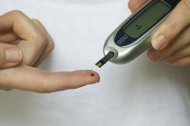 Pricking Finger to Check Blood Sugar