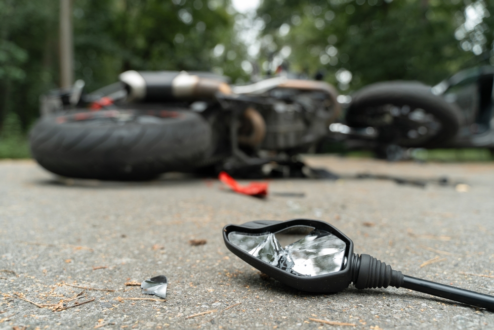 Damaged motorcycle in the street after an accident