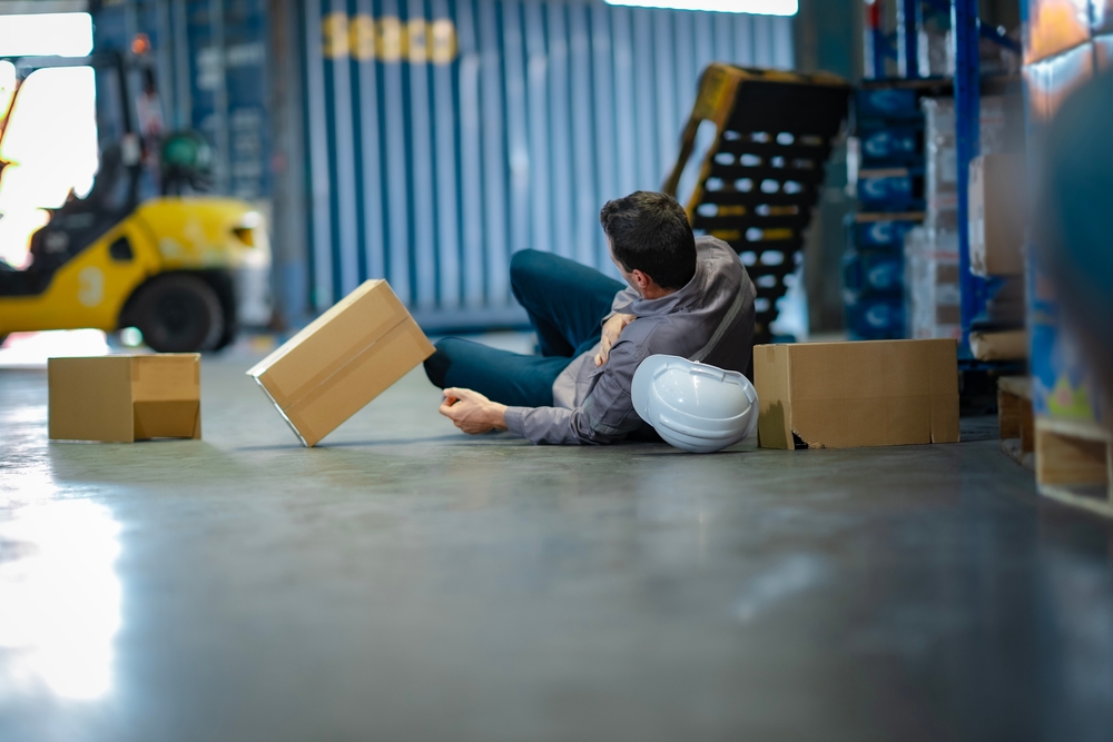Person being injured on jobsite due to improper stacking, violating OSHA regulations